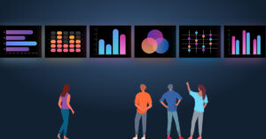 4 people looking at displays showing various charts